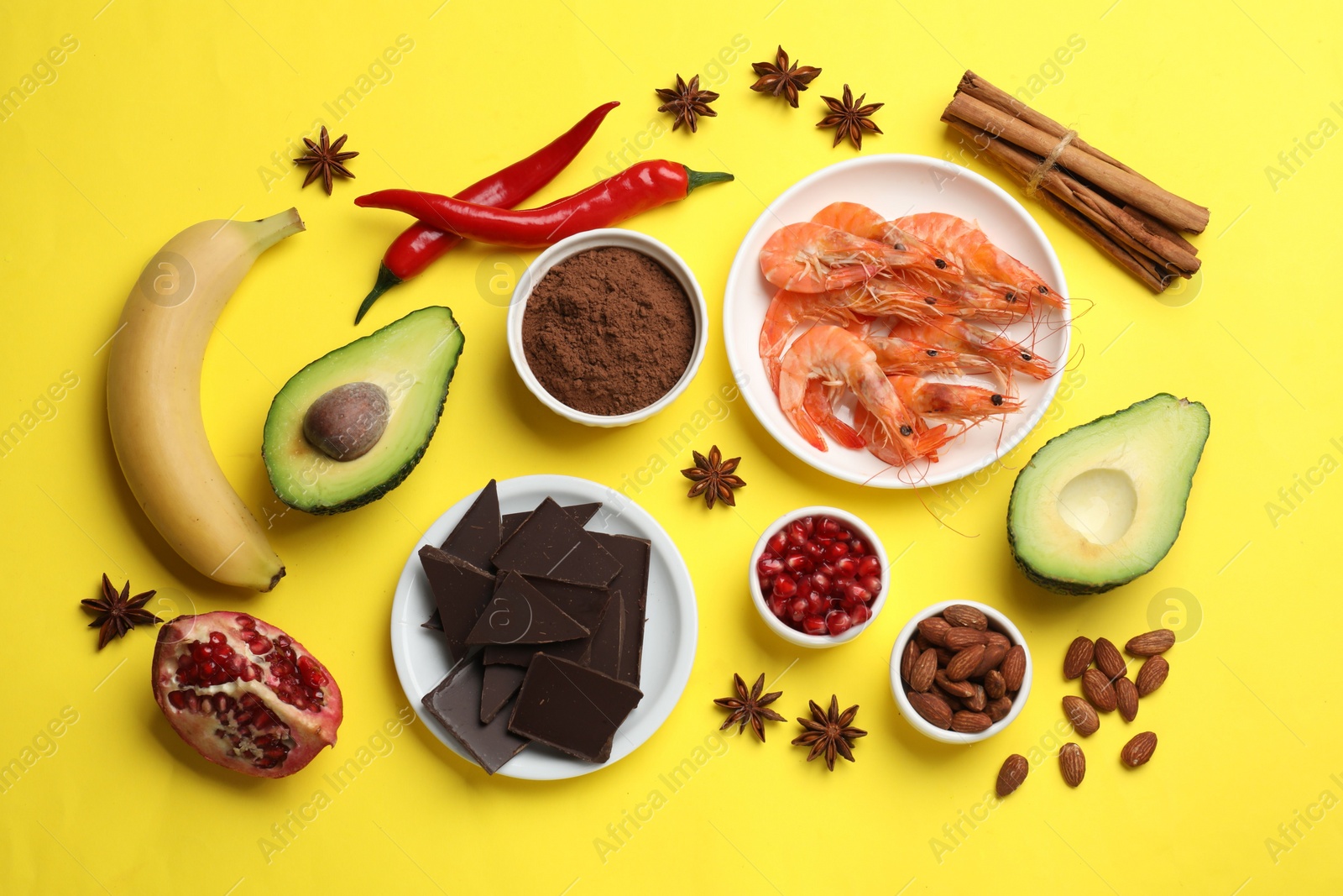 Photo of Natural aphrodisiac. Different food products on yellow background, flat lay