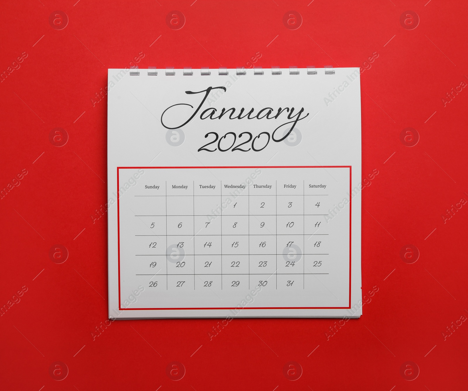 Photo of January 2020 calendar on red background, top view