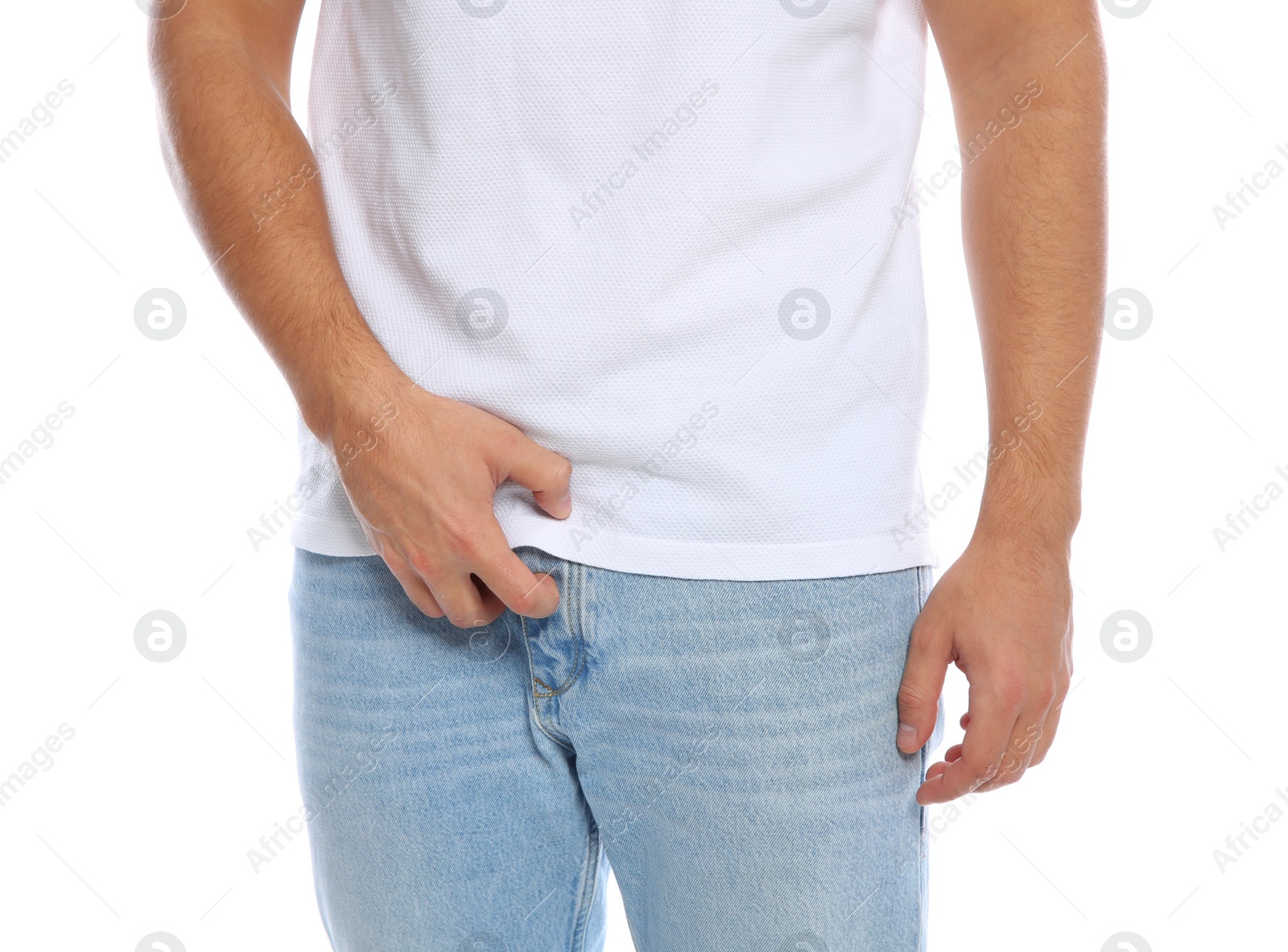 Photo of Man scratching crotch on white background, closeup. Annoying itch