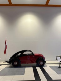 Photo of Hague, Netherlands - November 8, 2022: Beautiful view of red retro car in Louwman museum
