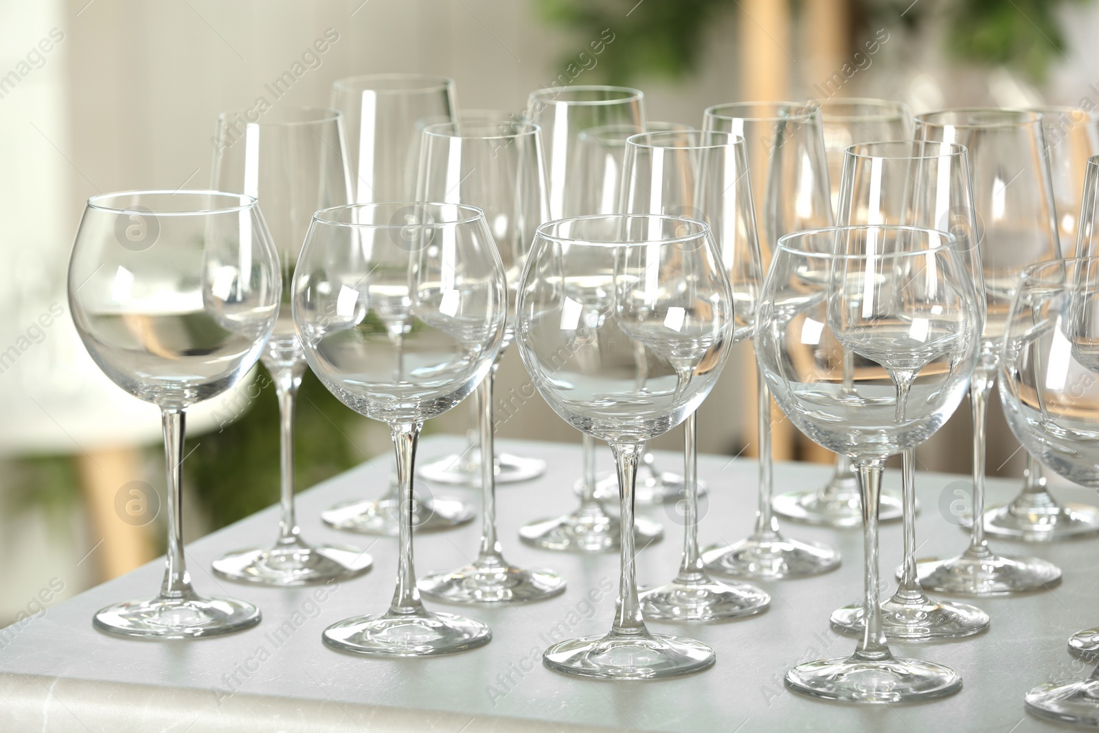 Photo of Set of empty glasses on grey table