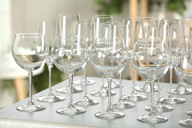 Photo of Set of empty glasses on grey table