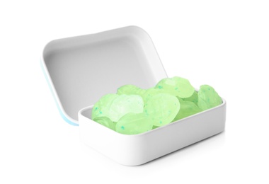 Open box with tasty mint candies on white background