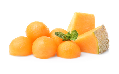 Photo of Melon balls and slices with mint on white background