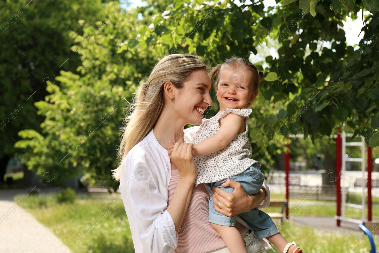 Photo of Happy mother with her daughter spending time together in park