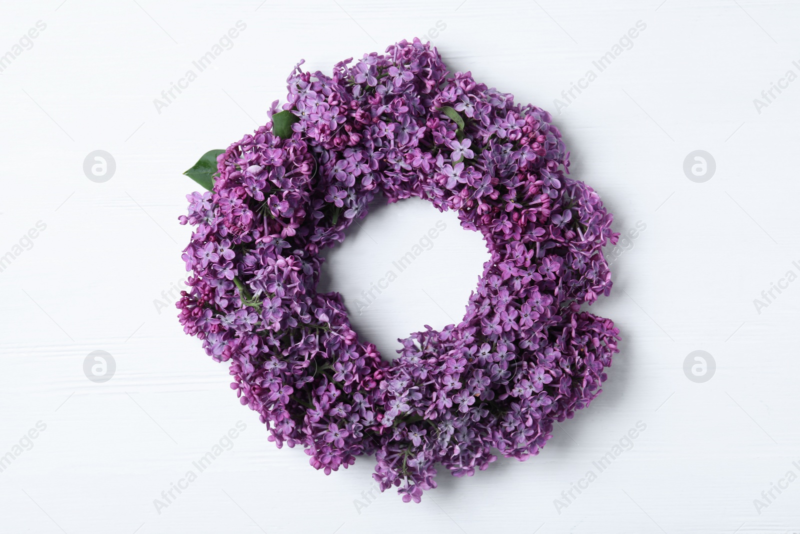 Photo of Flat lay composition with beautiful lilac blossom on white wooden background