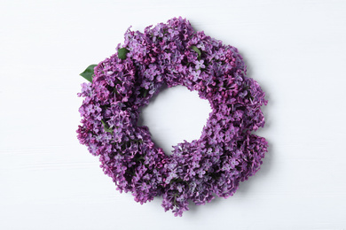 Flat lay composition with beautiful lilac blossom on white wooden background