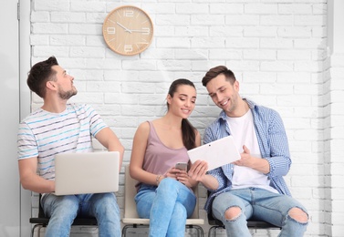 Photo of Group of people waiting for job interview, indoors