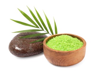 Green sea salt in bowl, palm leaf and spa stone isolated on white