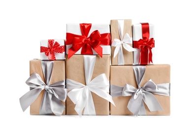 Photo of Beautifully wrapped gift boxes on white background