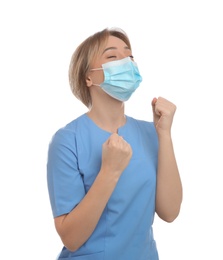 Photo of Emotional doctor with protective mask on white background. Strong immunity concept