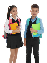 Little children with school stationery on white background