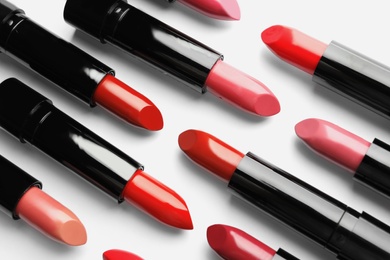 Photo of Flat lay composition with lipsticks on white background