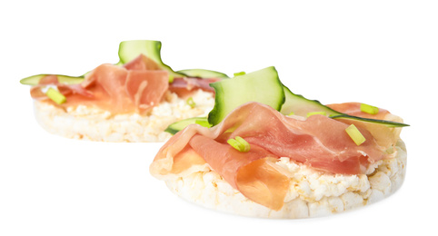 Puffed rice cakes with prosciutto and cucumber isolated on white