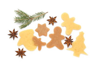 Photo of Unbaked Christmas cookies, anise and fir tree twig on white background, top view