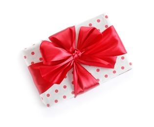 Photo of Beautifully wrapped gift box on white background, top view