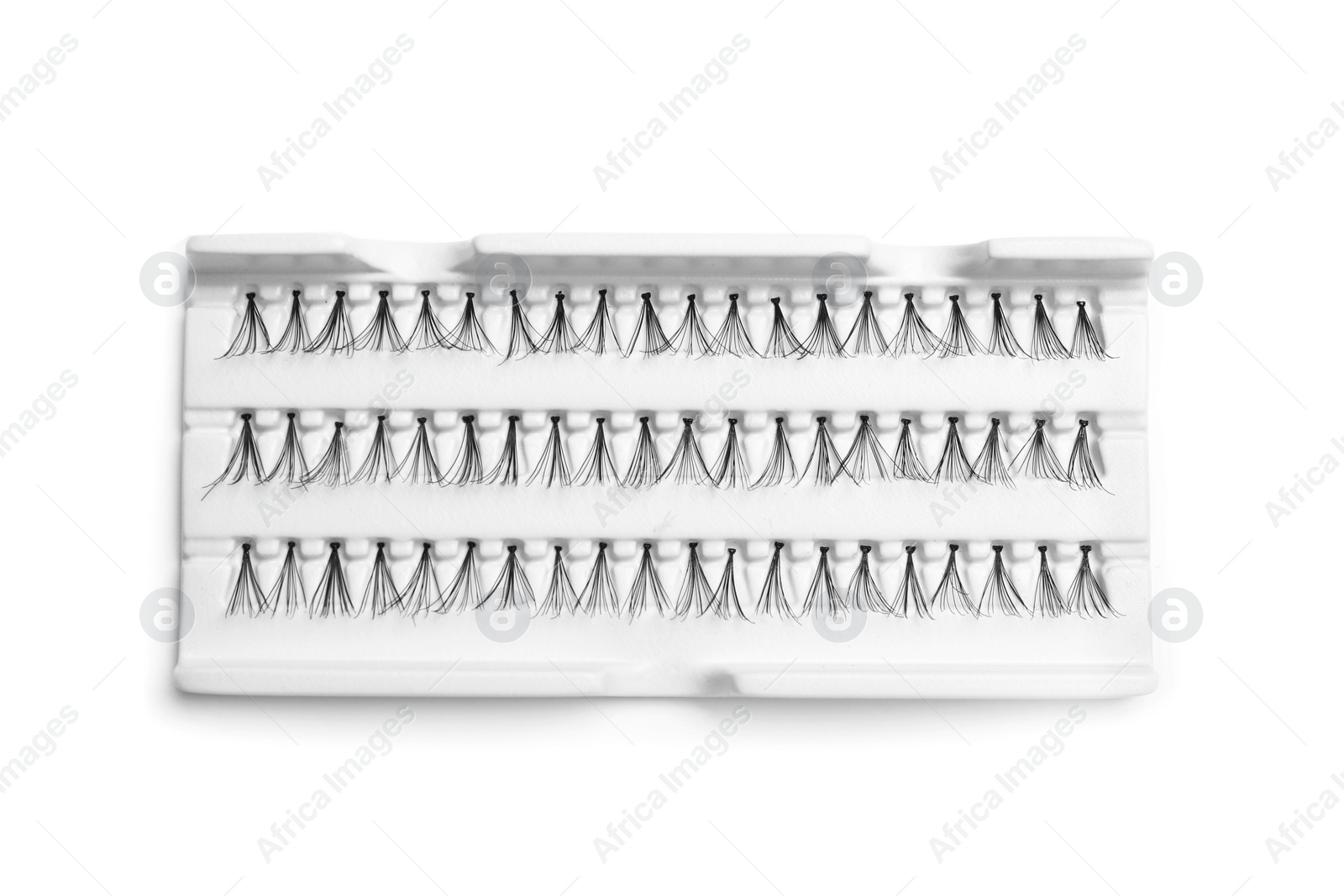 Photo of False eyelashes in pack on white background