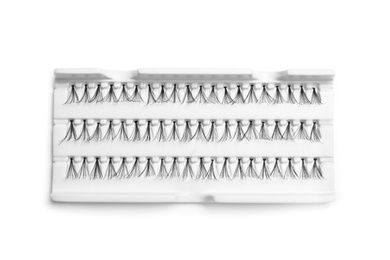 Photo of False eyelashes in pack on white background