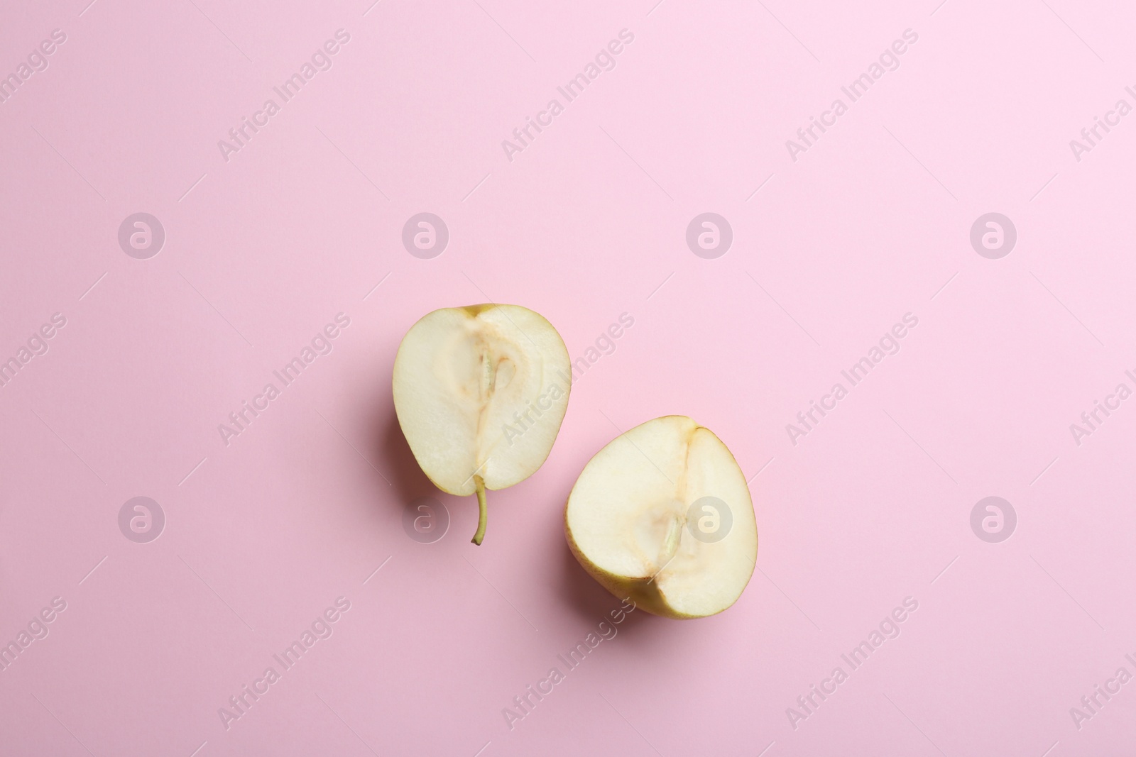 Photo of Ripe juicy pears on pink background, flat lay