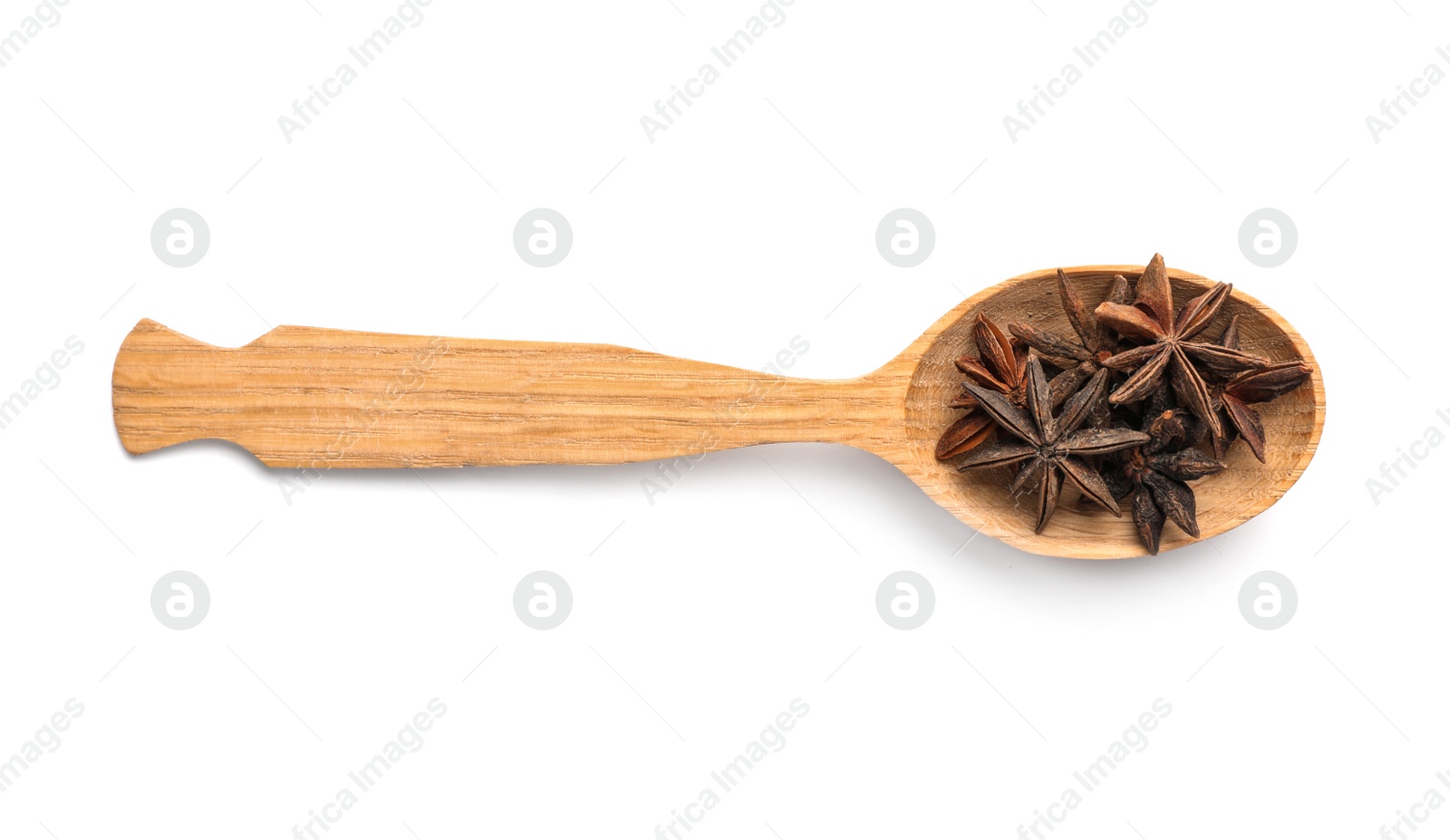 Photo of Wooden spoon with anise stars on white background. Different spices