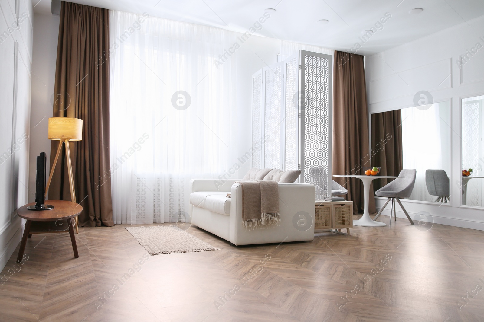 Photo of Modern living room with parquet floor and stylish furniture