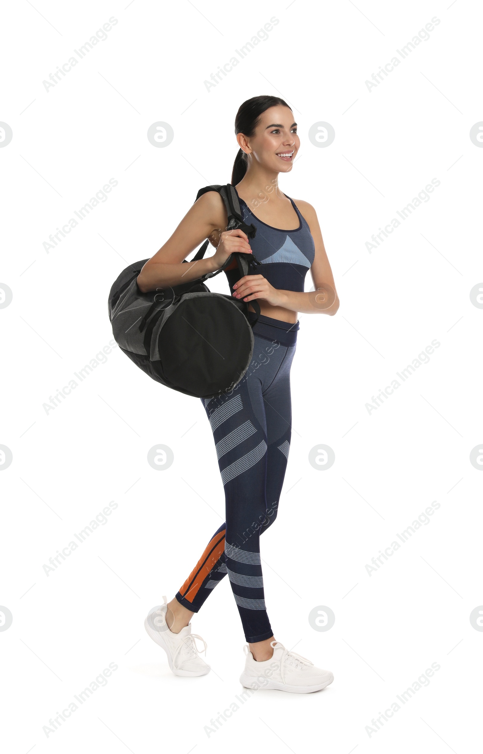 Photo of Beautiful woman with sports bag on white background