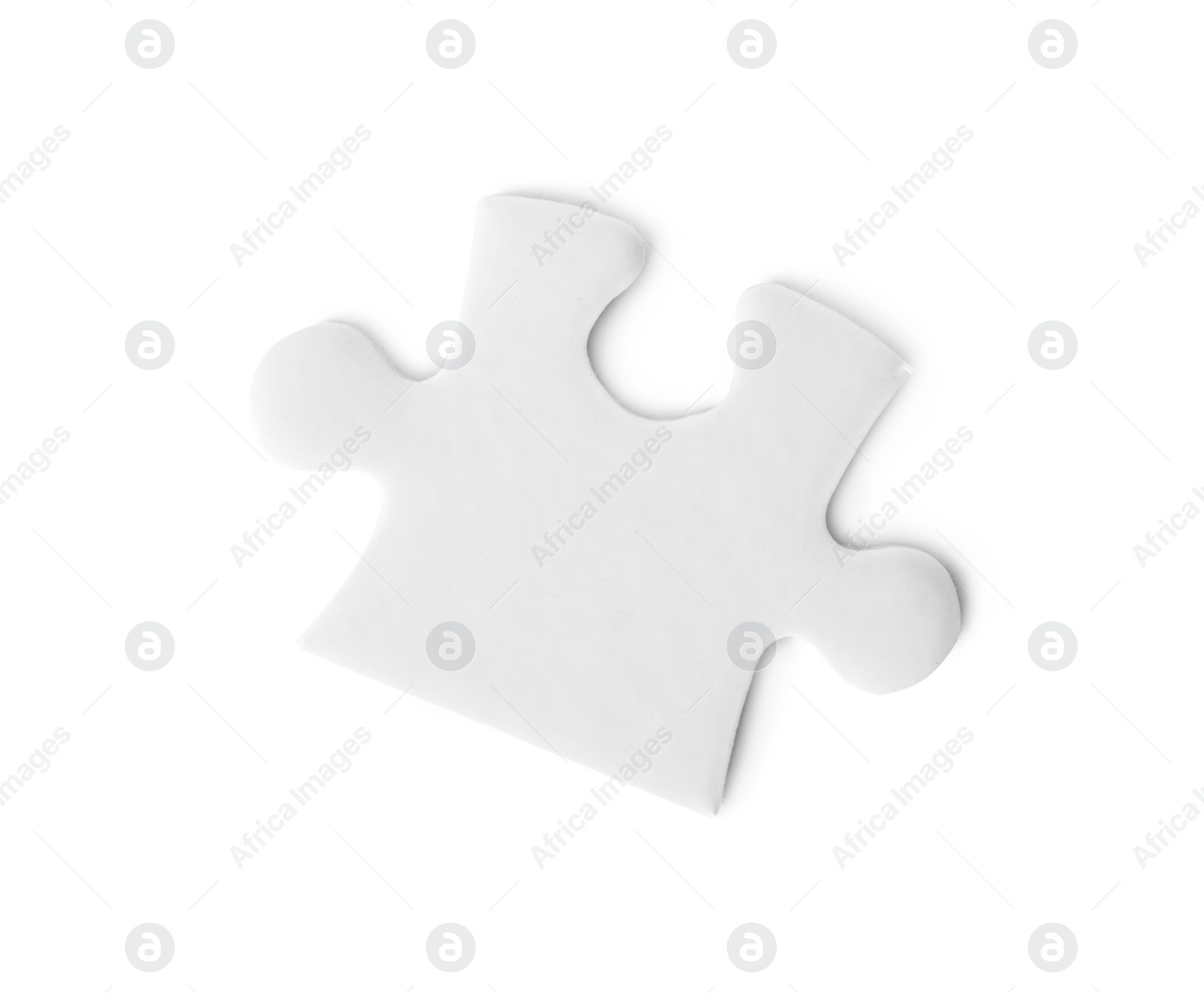 Photo of Blank puzzle piece isolated on white, top view