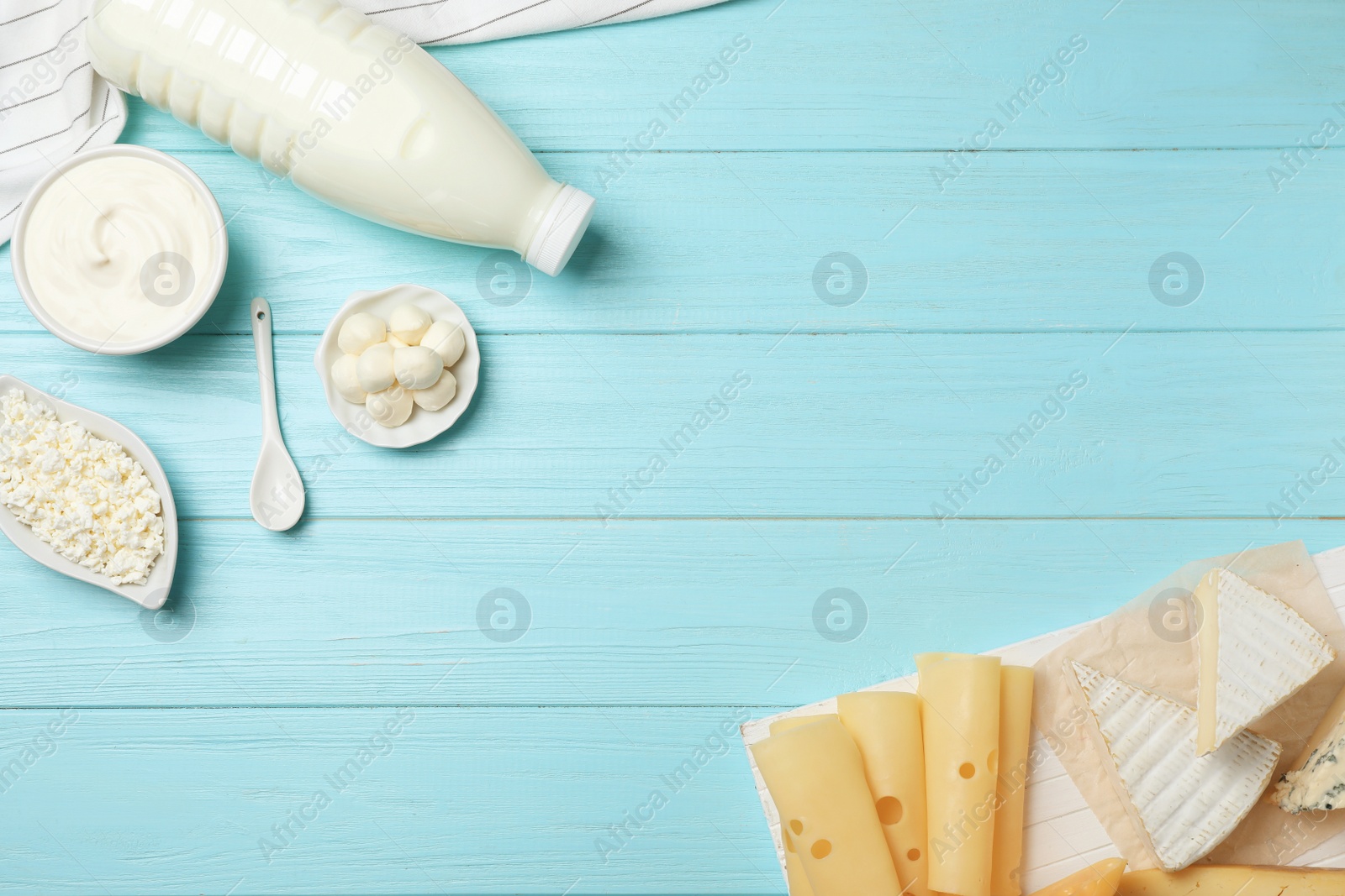 Photo of Flat lay composition with different dairy products on wooden background