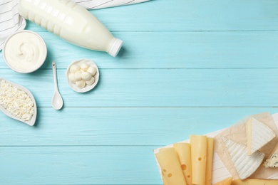 Flat lay composition with different dairy products on wooden background