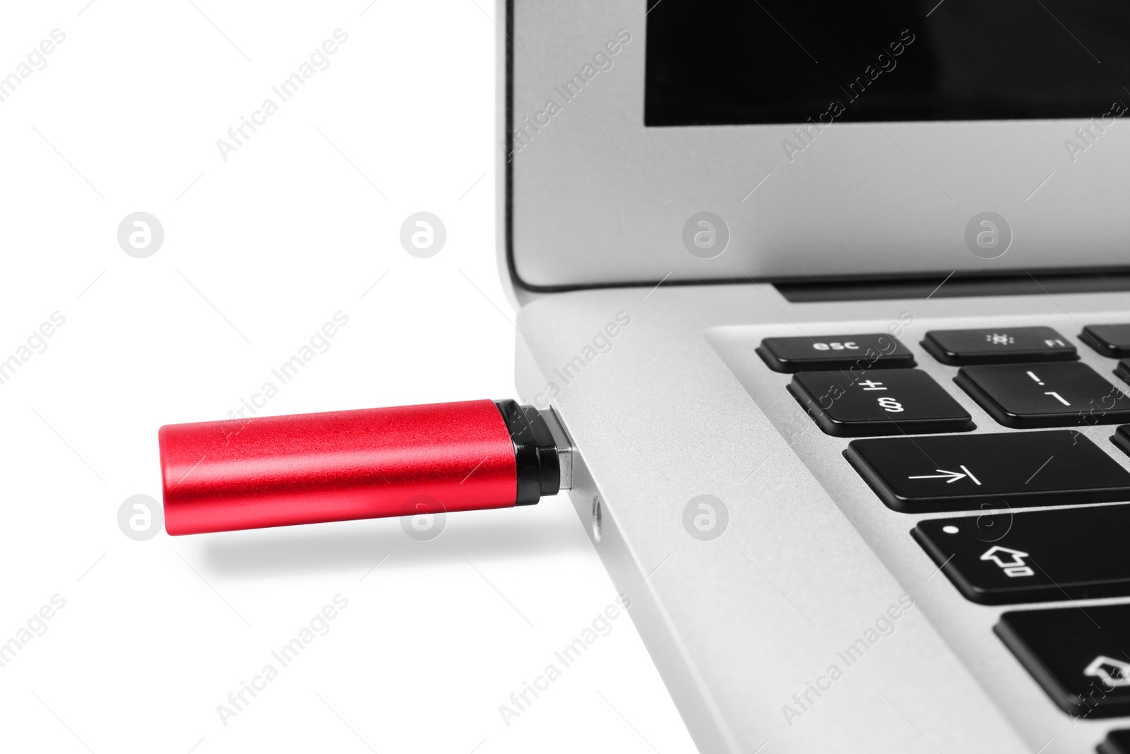 Photo of Usb flash drive attached into laptop on white background