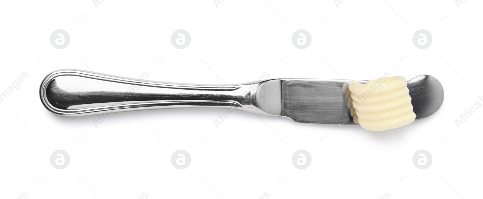 Photo of Butter curl on knife isolated on white, top view