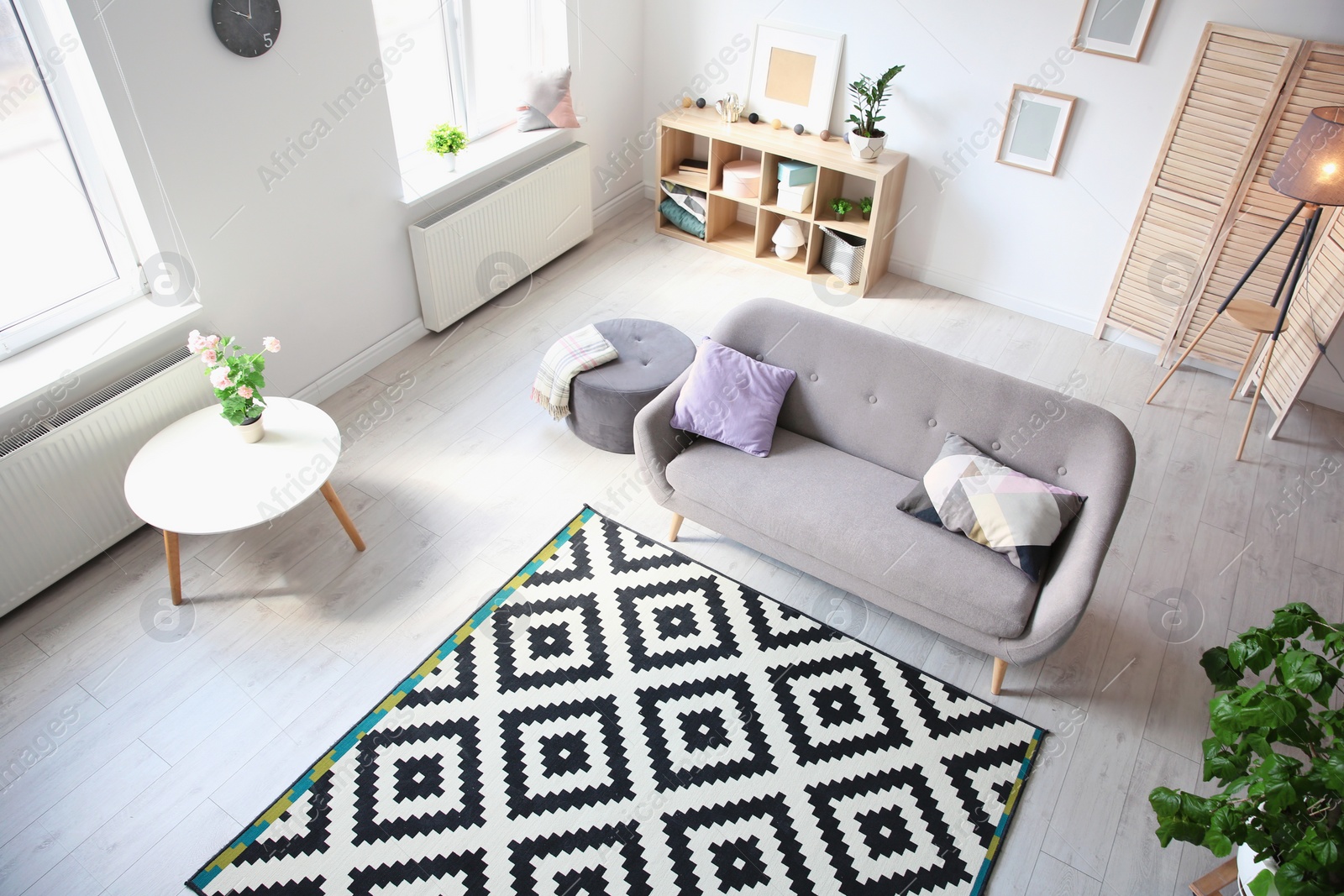 Photo of Living room interior with comfortable sofa, view through CCTV camera