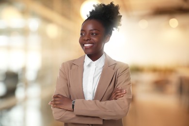 Lawyer, consultant, business owner. Confident woman smiling indoors