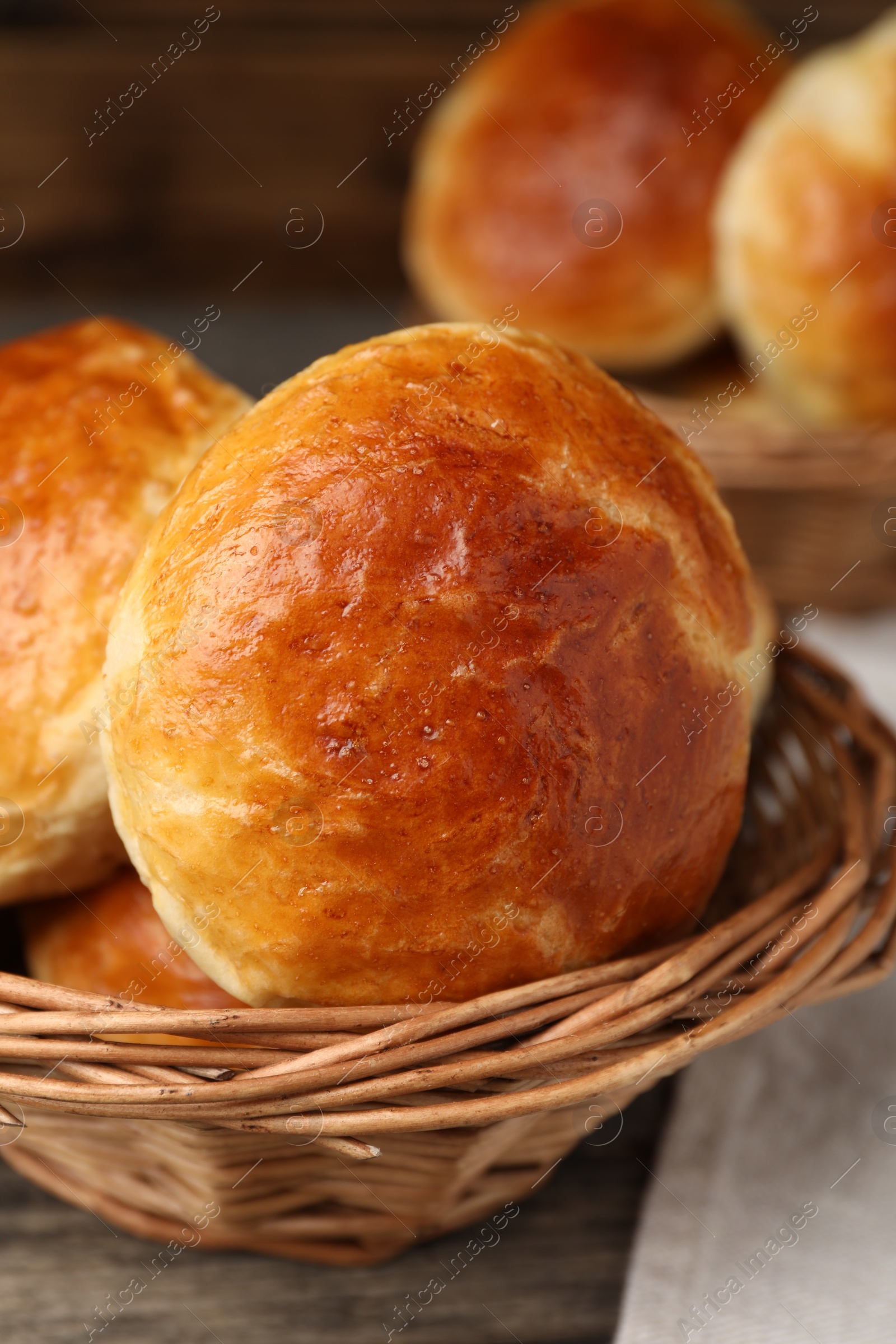 Photo of Freshly baked soda water scones on wooden table, closeup