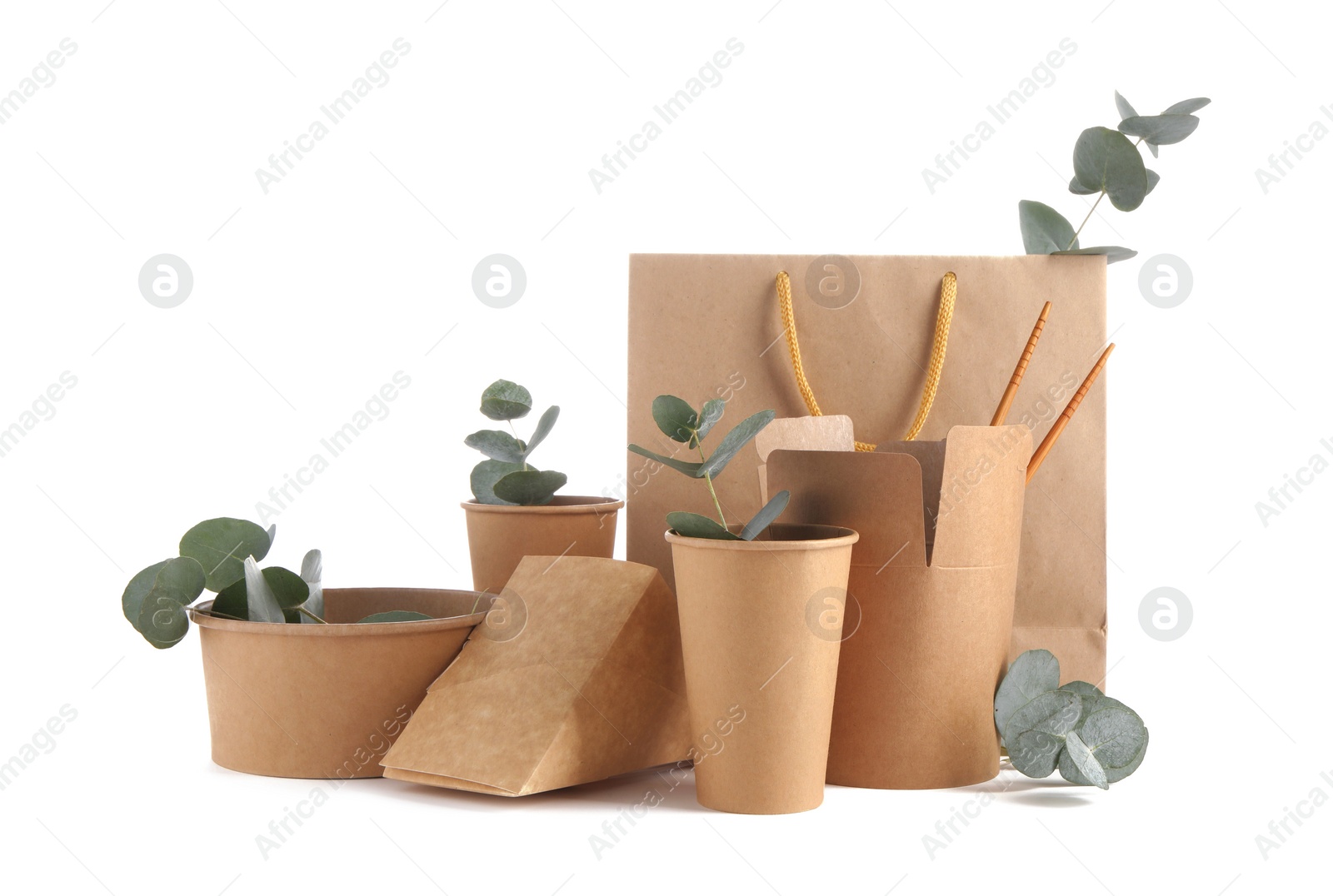 Photo of Eco friendly packaging. Disposable food containers, paper bag and eucalyptus leaves isolated on white