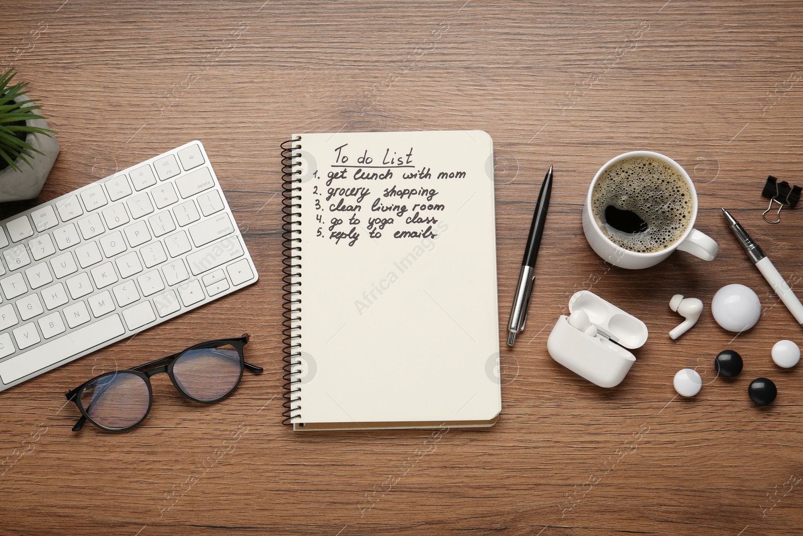 Photo of Flat lay composition with to do list on wooden table