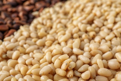 Pile of pine nuts as background, closeup