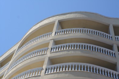 Photo of Exteriorresidential building with balconies against blue sky, low angle view