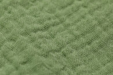 Photo of Texture of soft green fabric as background, closeup