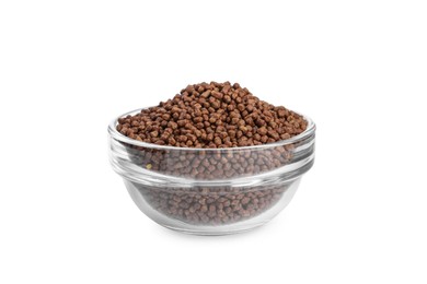 Buckwheat tea granules in glass bowl on white background