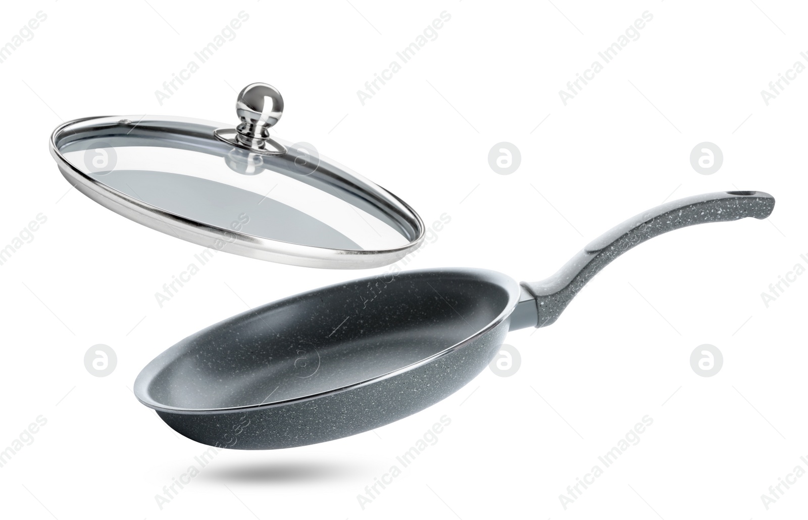 Image of New frying pan and glass lid on white background