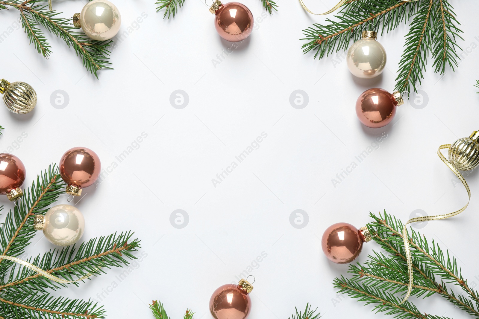 Photo of Frame of Christmas tree branches and festive decoration on white background, top view. Space for text