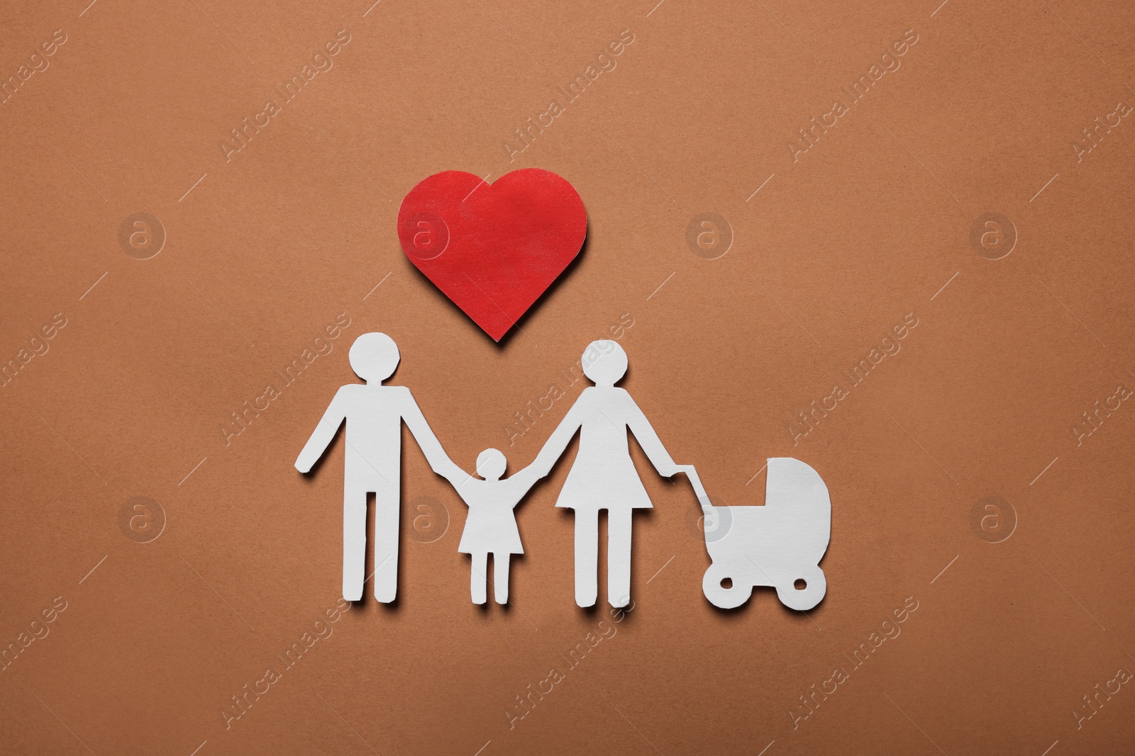 Photo of Paper family figures and red heart on brown background, flat lay. Insurance concept