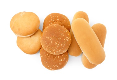 Photo of Tasty fresh burger and hotdog buns isolated on white, top view