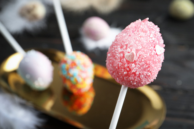 Photo of Closeup view of delicious sweet cake pop, space for text. Easter holiday