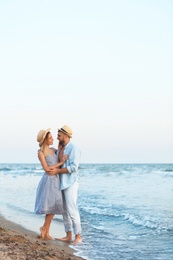 Young couple spending time together on beach