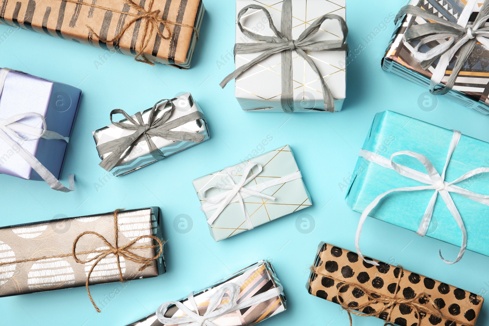 Photo of Flat lay composition with beautiful gift boxes on color background