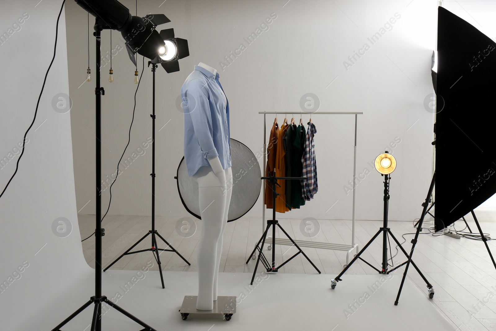Photo of Ghost mannequin with modern clothes in professional photo studio