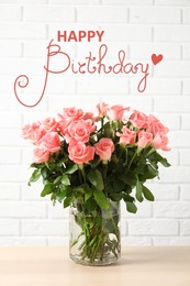 Happy Birthday! Vase with beautiful rose flowers on table near white brick wall  