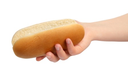 Woman holding tasty hot dog bun on white background, closeup